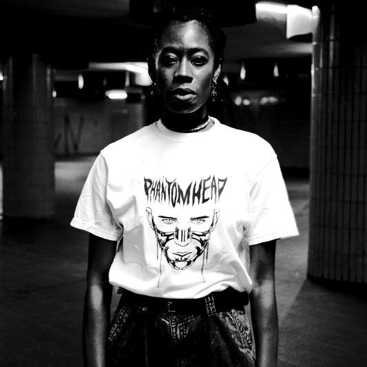 Nkech "Kay" wearing "Mask" BBB baobabwod artwear t-shirt by Berlin Artist PHANTOM HEAD in Berlin. White T-Shirt Mask design by Keinesel. Limited Edition Shirt - Art Collection 20 PIECES 